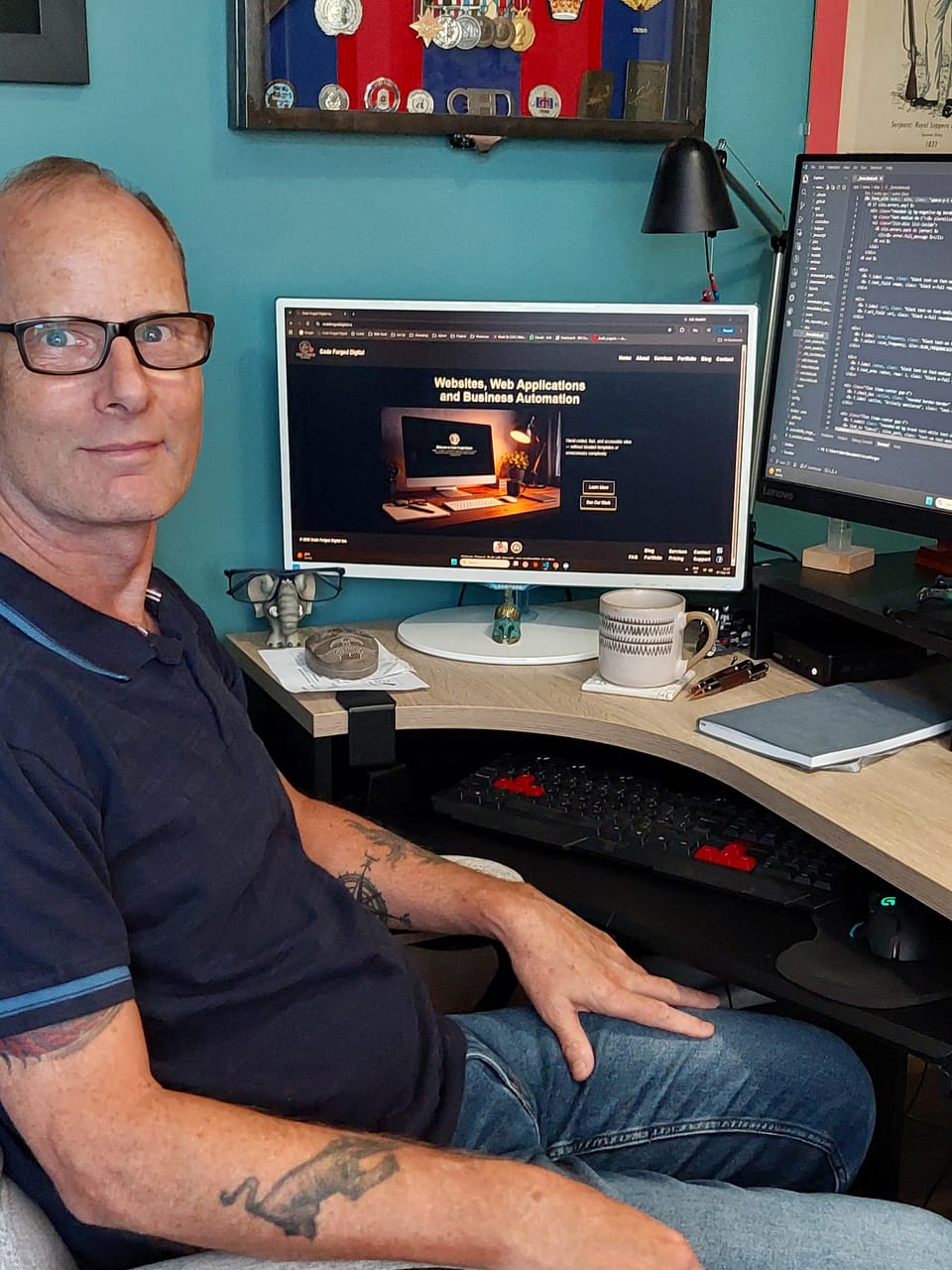 Dan, founder of Code Forged Digital, at his desk.